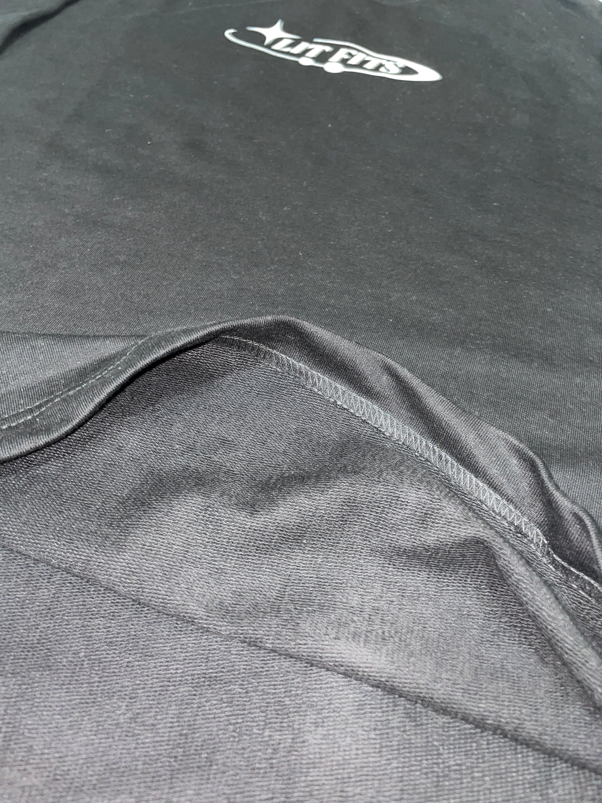 Black oversized fit T-shirt showcasing premium 240 gsm french terry fabric and HD print detail.